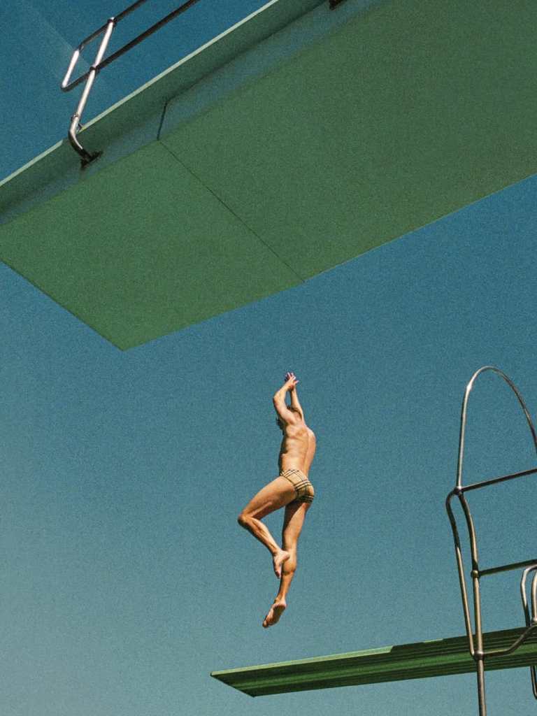 Burberry campaign model poolside sunlight British lifestyle